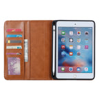 Elevate your iPad Mini 5 (7.9-inch, 2019) with our handcrafted leather folio case. Designed for the modern professional, it combines vintage aesthetics with rugged functionality. Shock resistant, leather wallet with 5 card slots, 2 note slots,1 big pocket, magnetic closure and built-in pencil slot